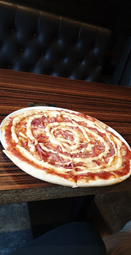 Grand Pizza - Gastronomi och hotellverksamhet